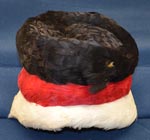 a%20satin%20feathered%20tall%20tiered%20hat%20that%20is%20black%2C%20red%20and%20white